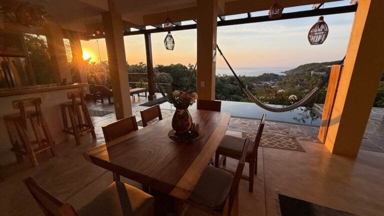Dining area at sunset with ocean views at Casa La Vista, Mazunte