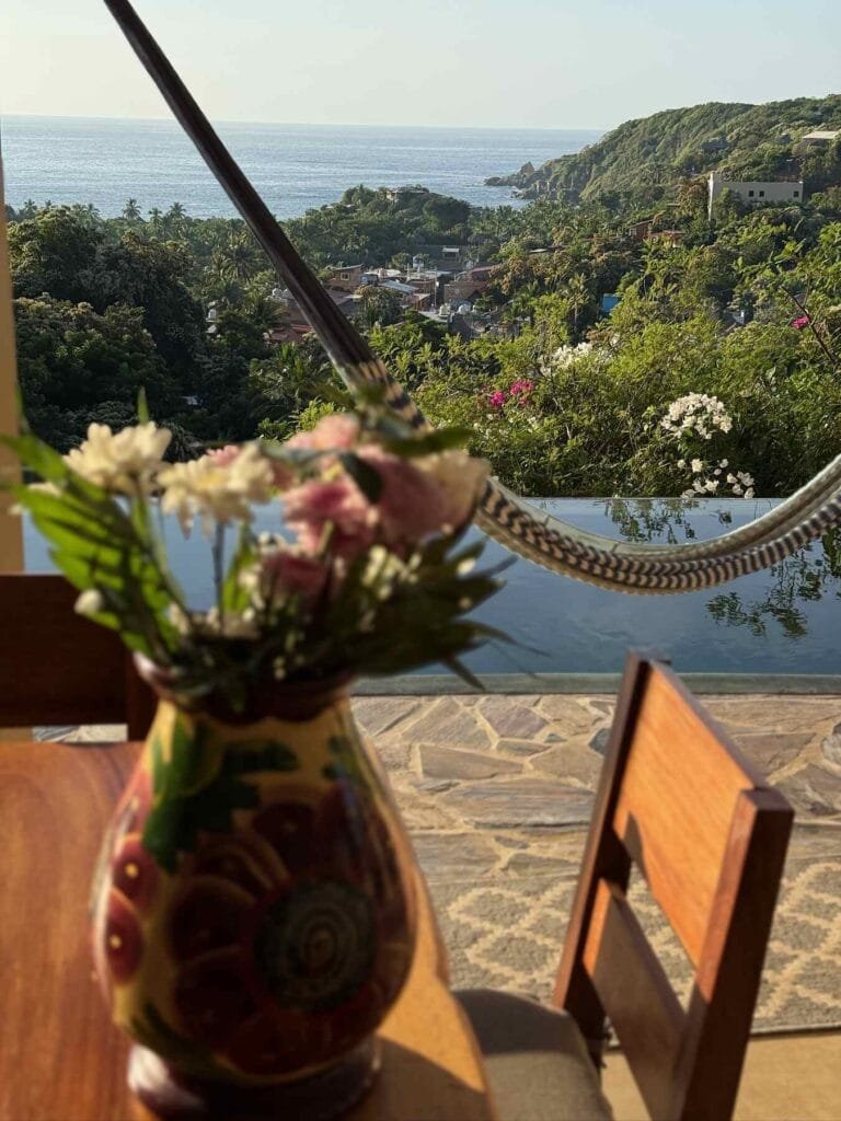 Fresh flowers on the table with garden views at the villa